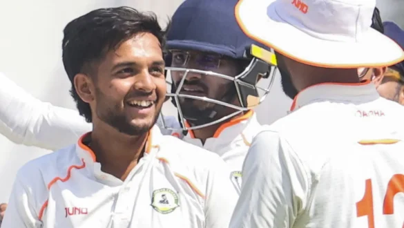Harsh Dubey celebrates a record-breaking wicket in the Ranji Trophy final
